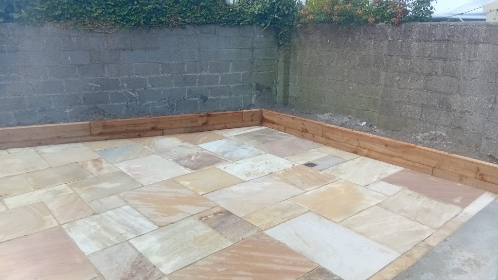 Indian sandstone patio and railway sleepers 6